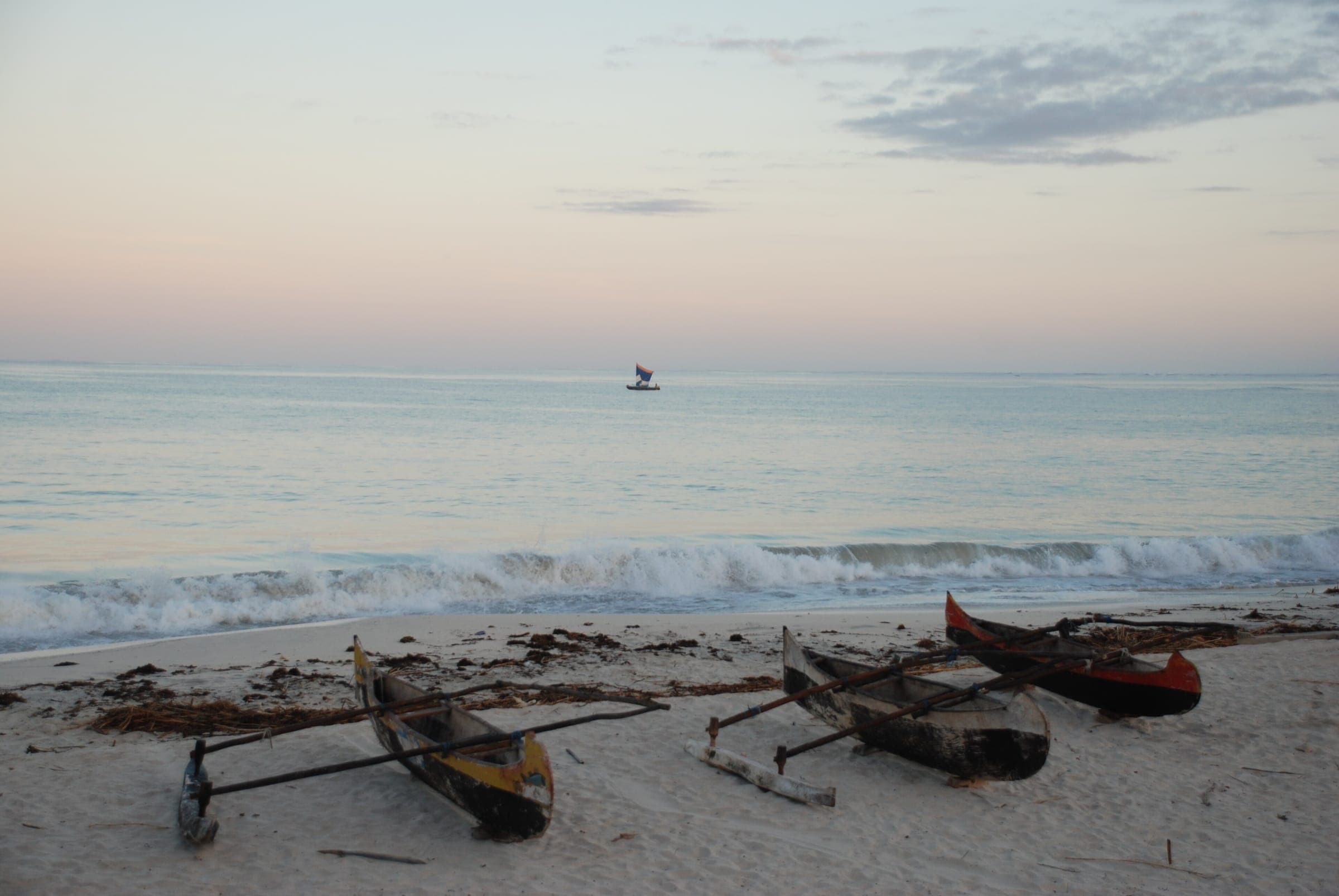 Outrigger canoes pulled up on a south-western beach